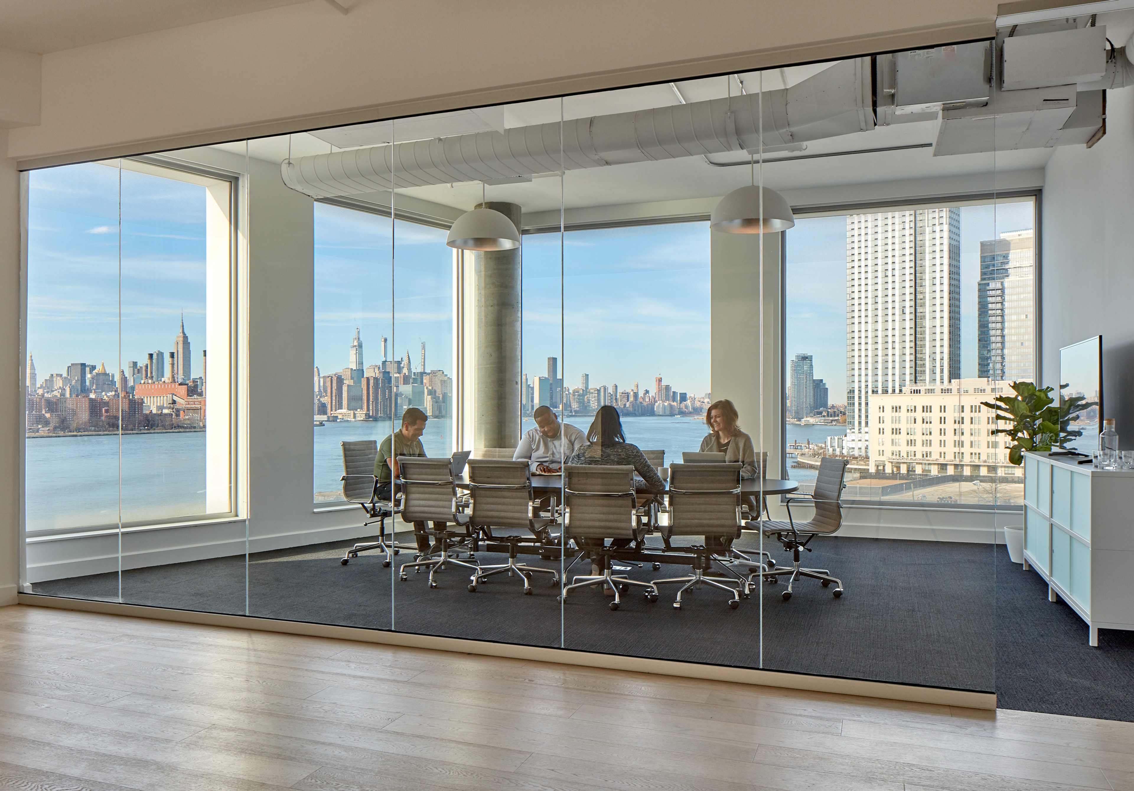 Conference room featuring river and Manhattan views at 10 Grand Street