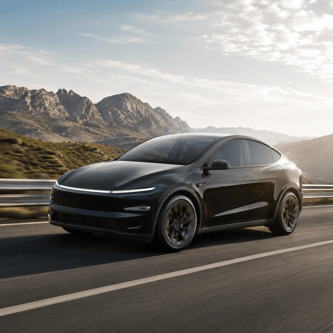 Black electric car on a mountain road