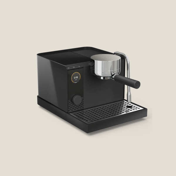 Black Fellow Espresso 1 Series espresso machine on tan background