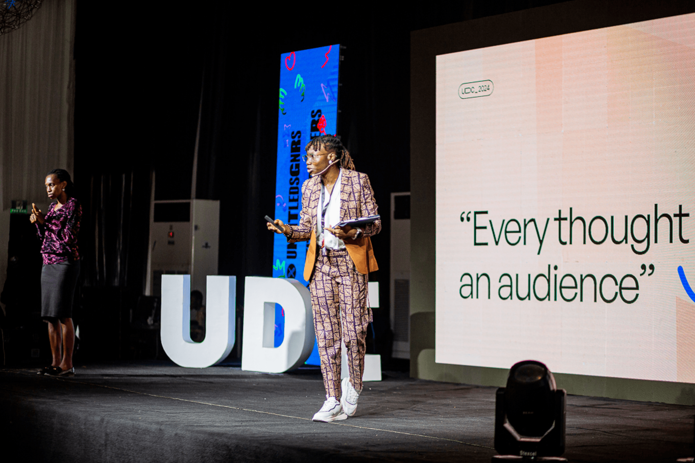 Bolutife speaking on stage