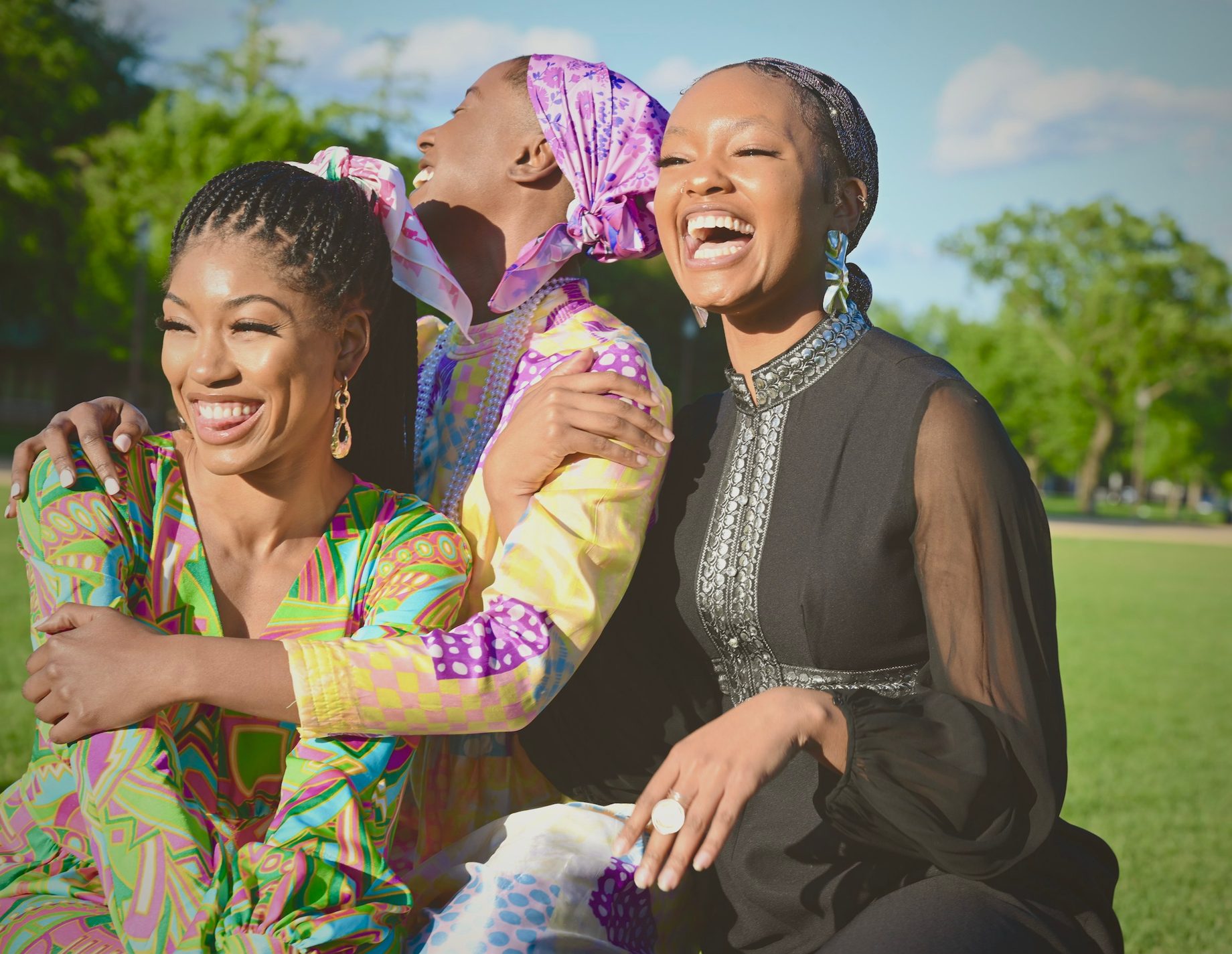 Women in bold prints laughing together