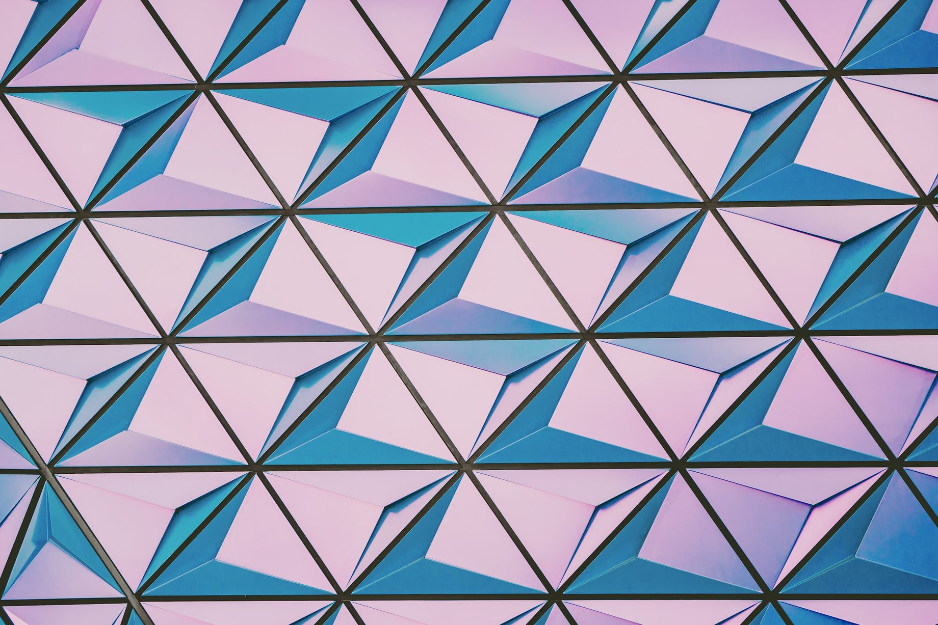 A repeating pink and blue geometric pattern
