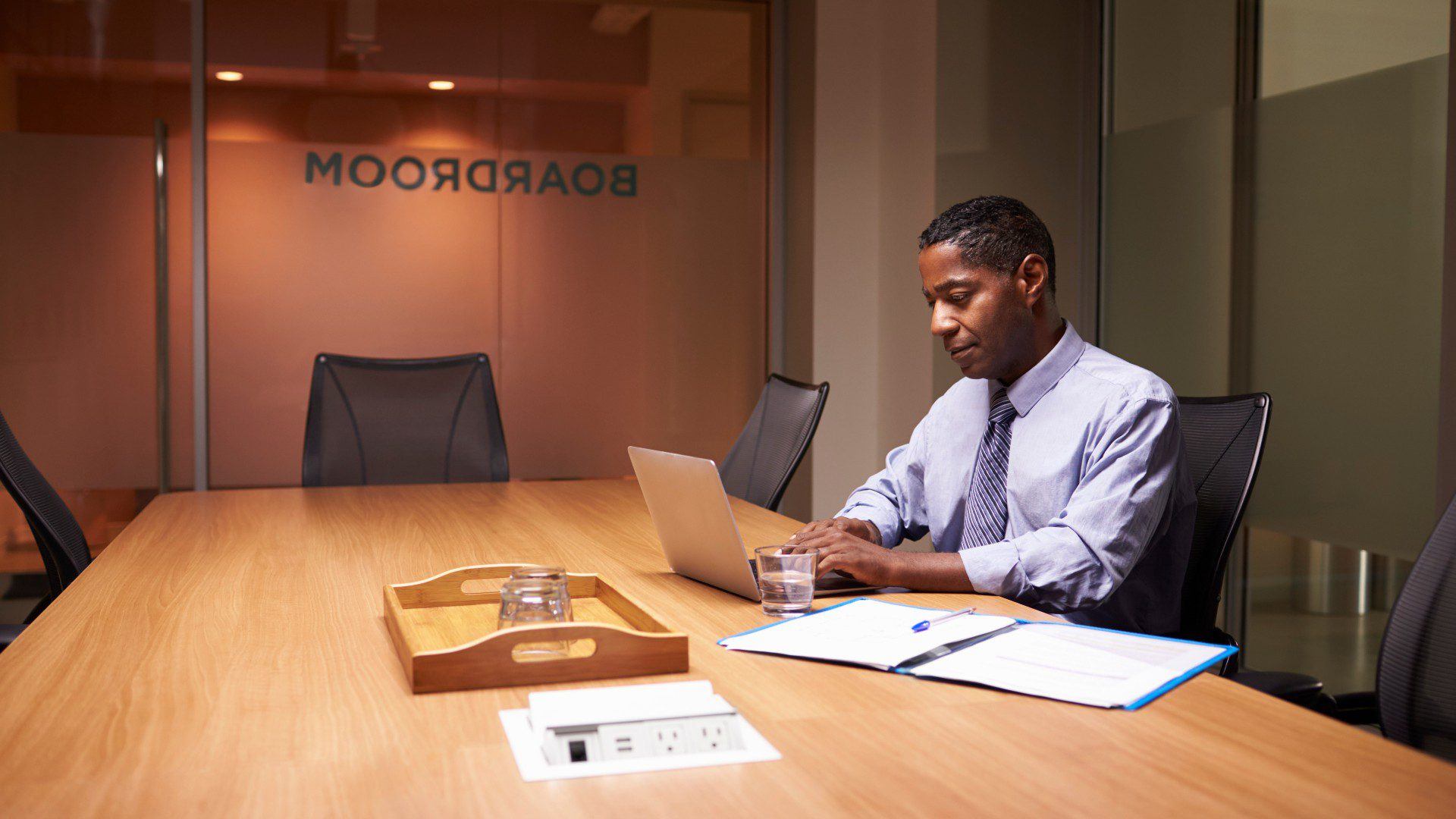 Middle aged businessman working late alone in office