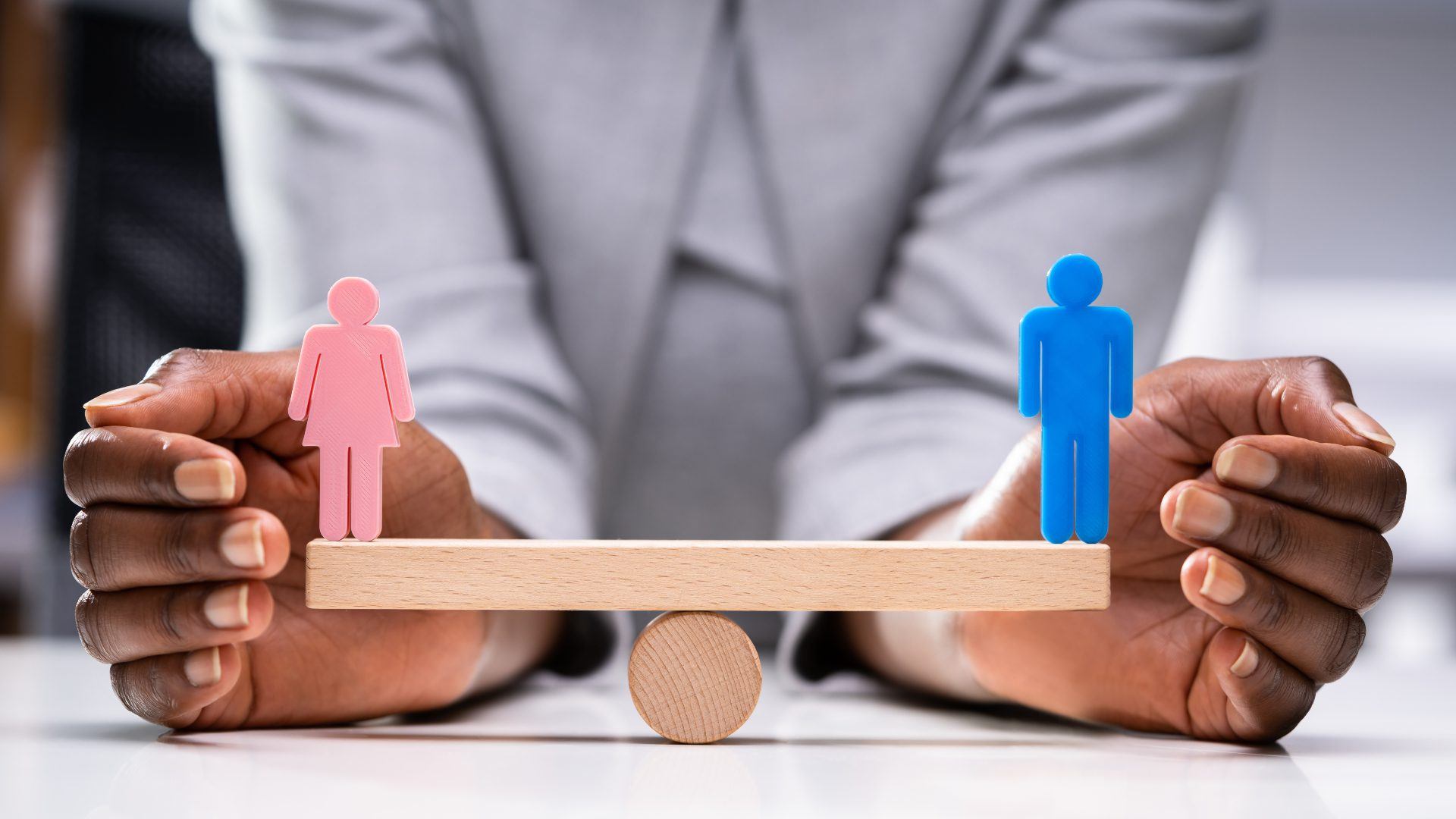 Equal Gender Balance And Parity - male and female icons on a seesaw