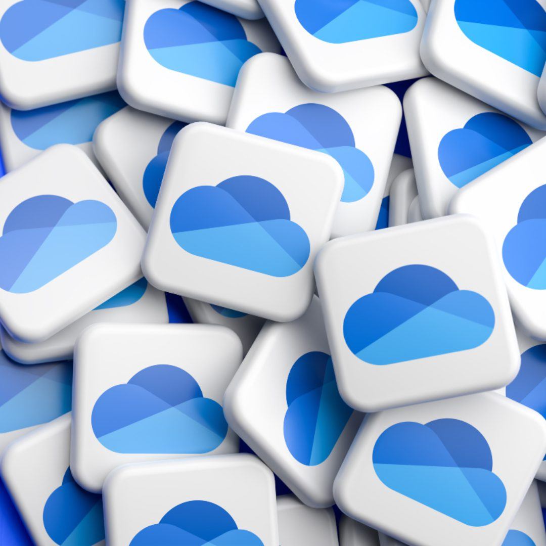 Logos of the Cloud Drive service Microsoft OneDrive on a heap on a table.|Logos of the Cloud Drive service Microsoft OneDrive on a heap on a table.