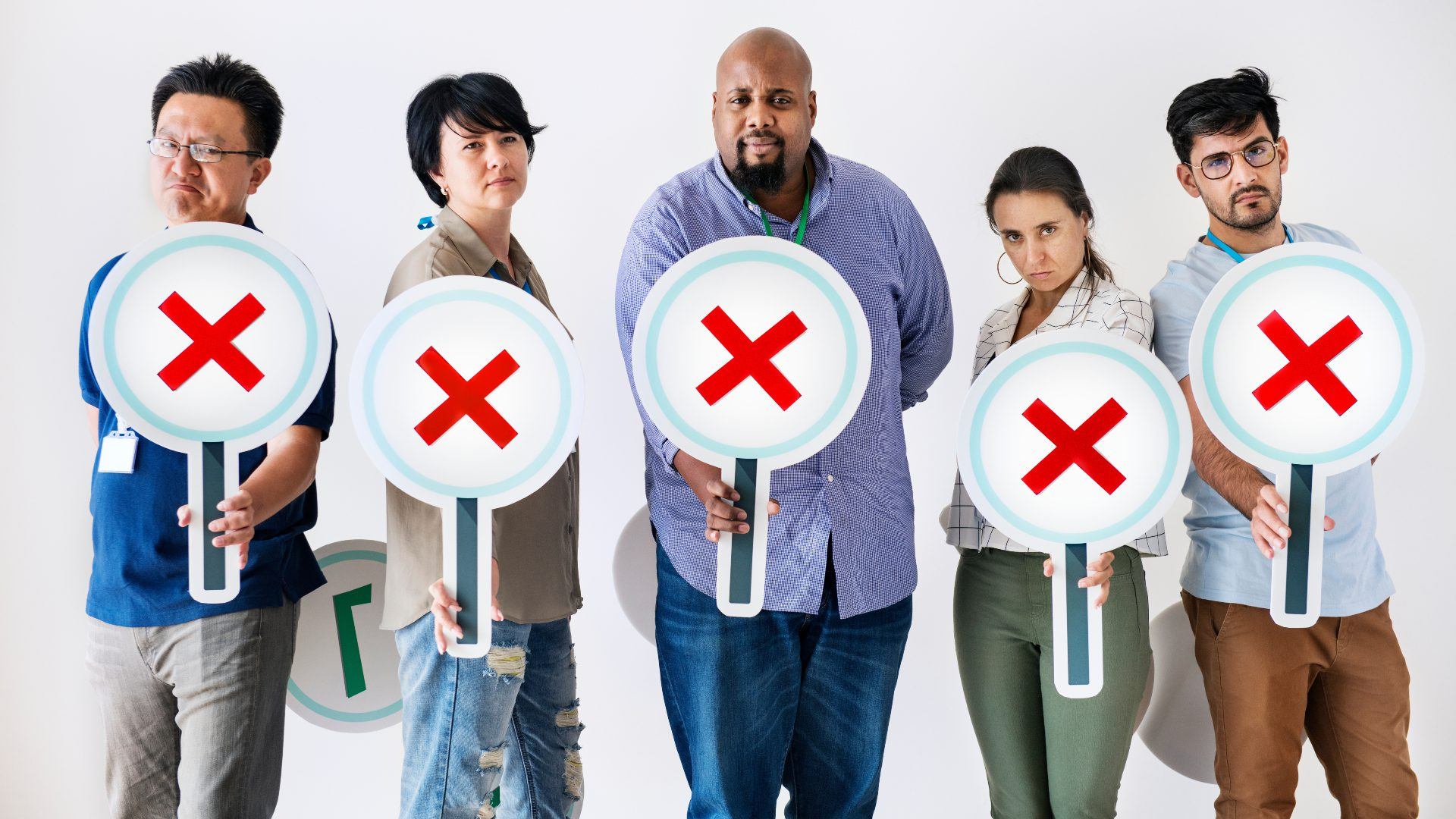 Workers standing and holding incorrect tick boxes
