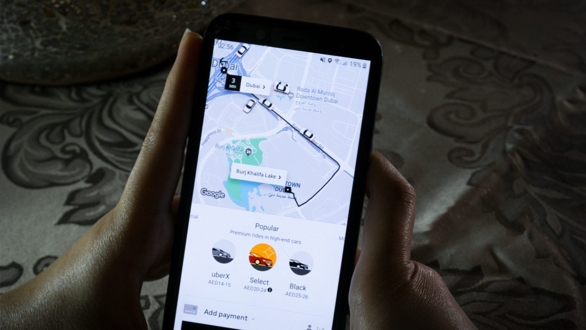 Using the Uber app on a smartphone - City maps and transportation