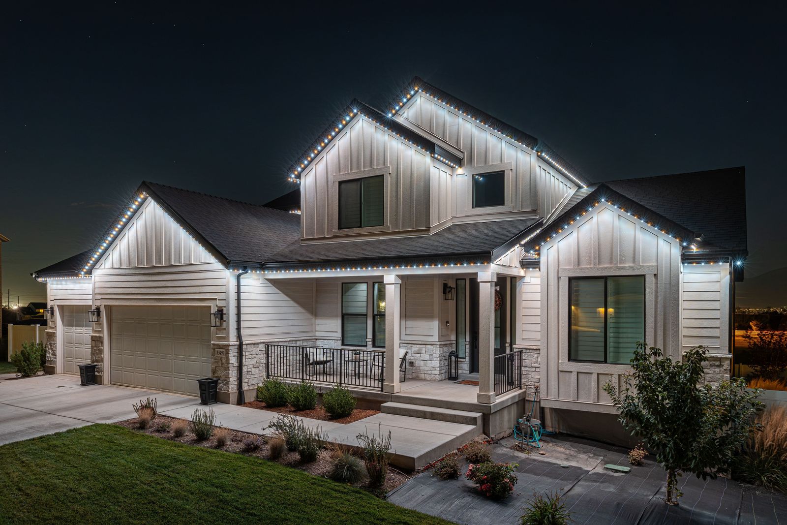 Same home at night with permanent LED trim lighting turned on