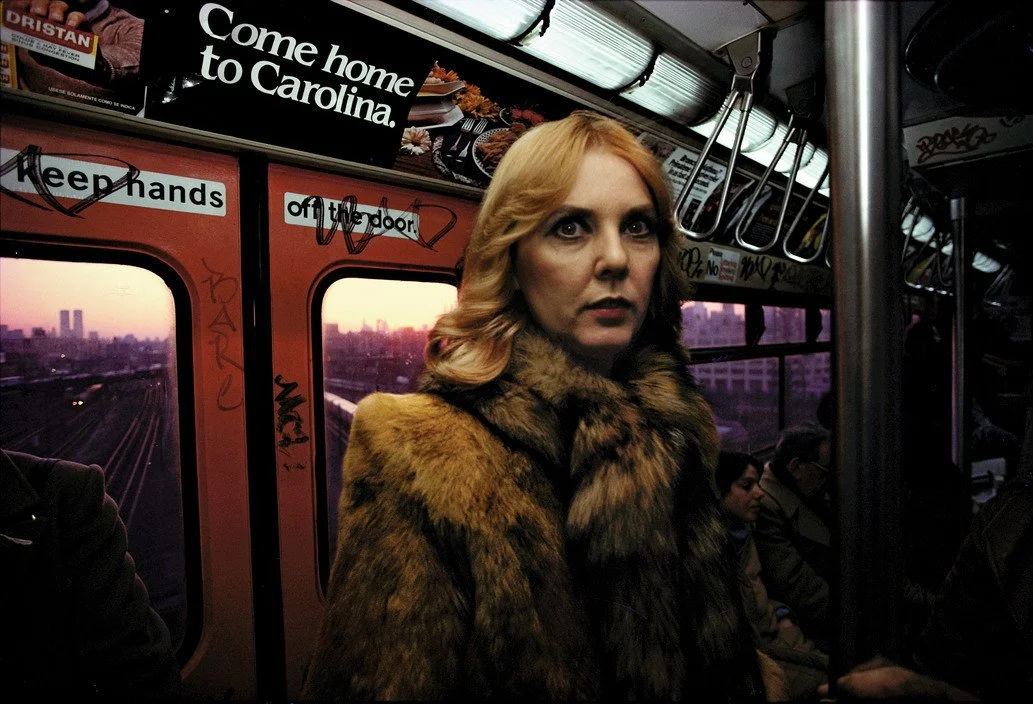 Bruce Davidson photograph of a red-haired woman in a fur coat inside a subway carriage