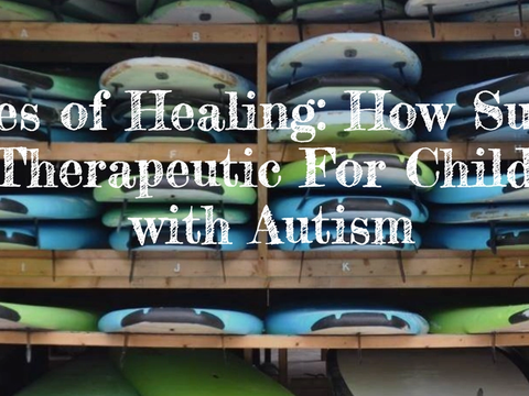 Text "Waves of Healing: How Surfing is Therapeutic For Children with Autism" over a rack of stacked surfboards