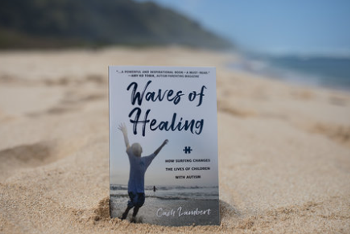 Waves of Healing book cover standing upright in beach sand