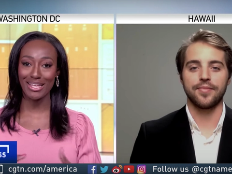 Split-screen CGTN Global Business segment: an anchor in Washington DC and Cash Lambert via Skype from Hawaii