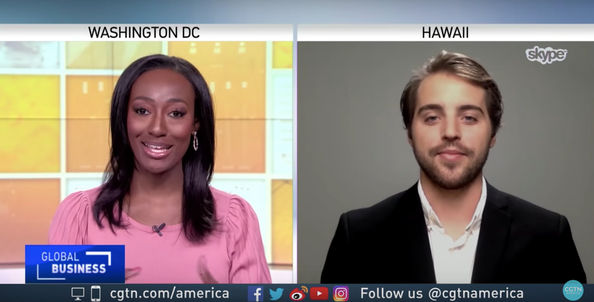Split-screen CGTN Global Business segment: an anchor in Washington DC and Cash Lambert via Skype from Hawaii