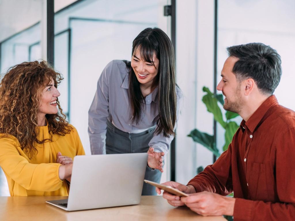 Team of three professionals during a meeting in an office