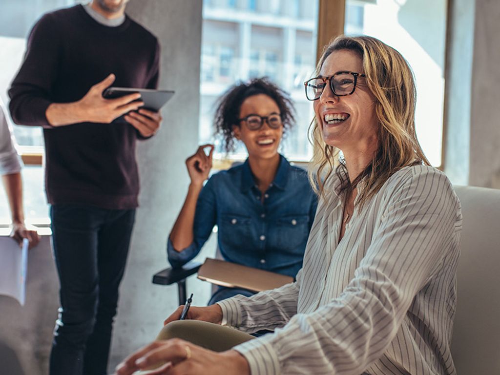 People smiling in an office
