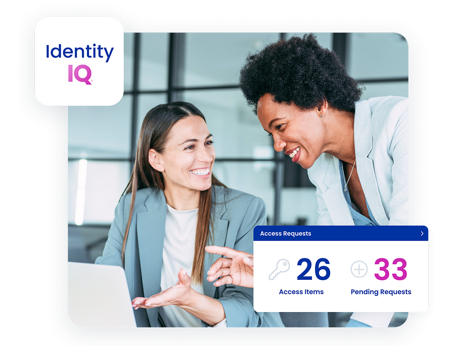 Two colleagues reviewing IdentityIQ access in a hybrid workplace