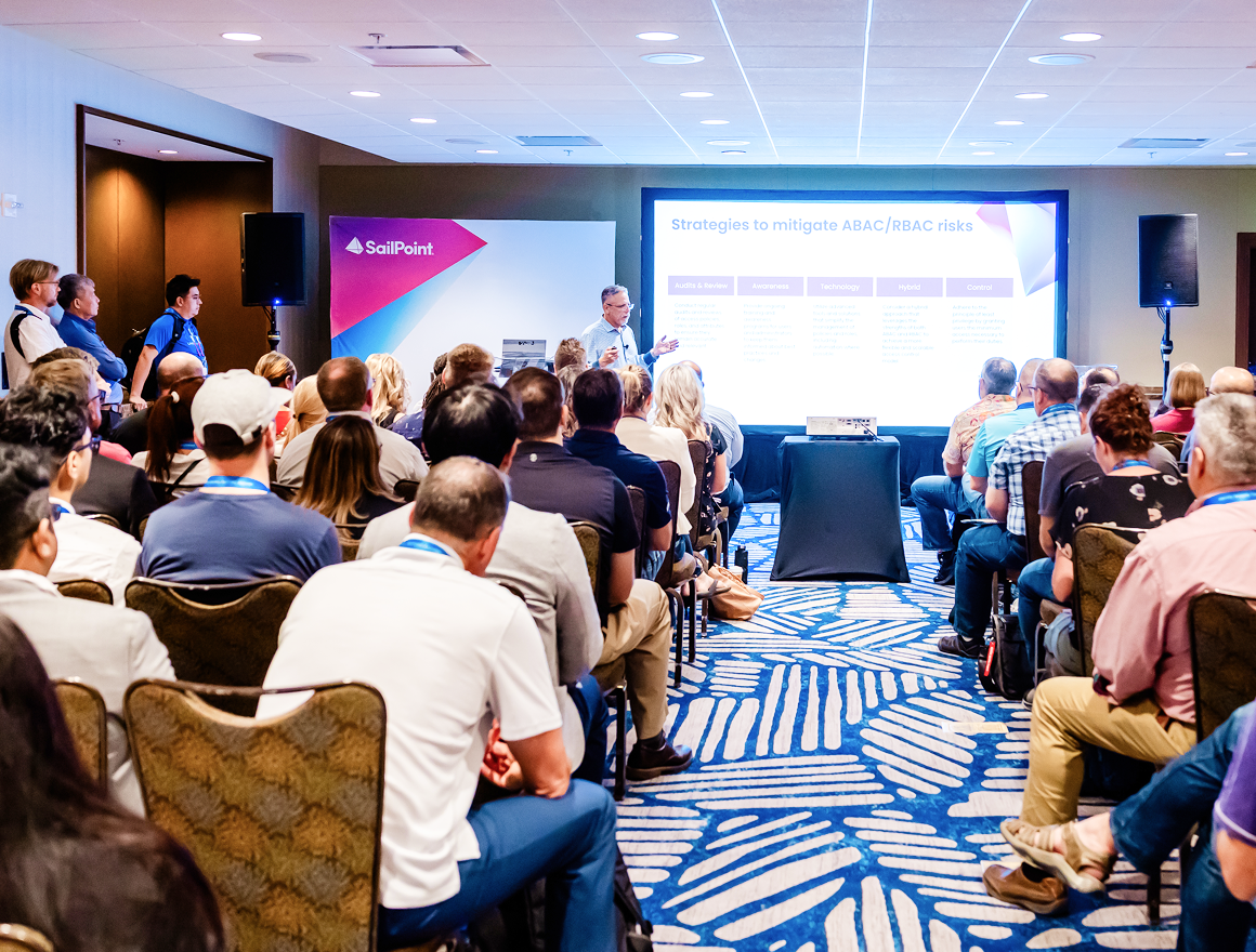 Attendees at Navigate conference watching a presentation