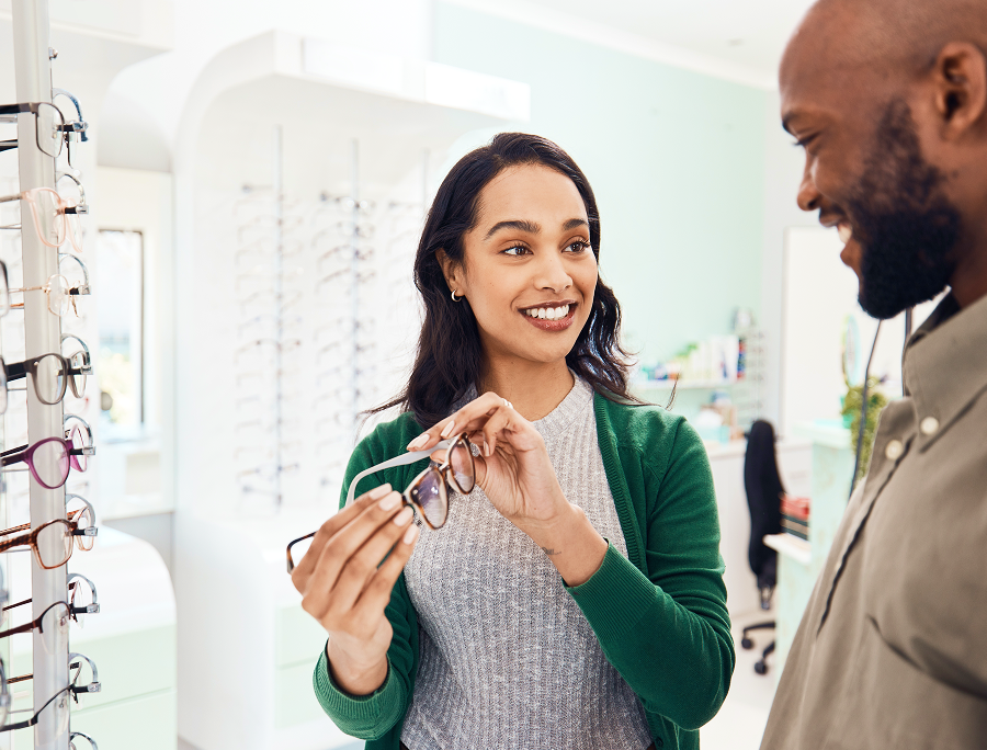 Specsavers optician helping a customer