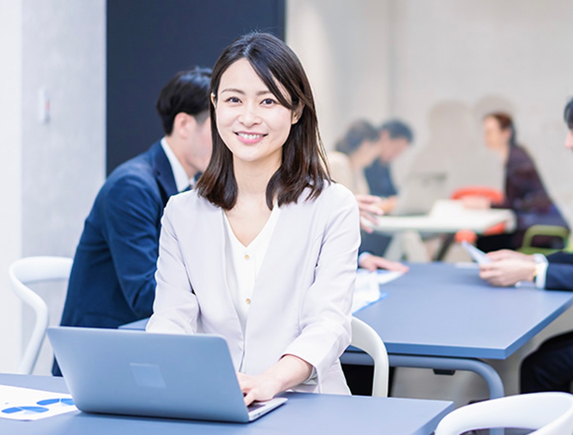 smiling woman using laptop 
