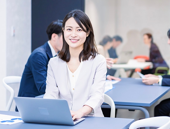smiling woman using laptop