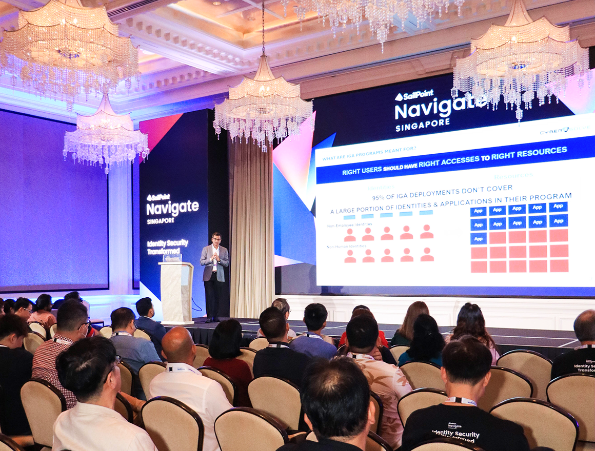 Attendees at Navigate conference watching a presentation