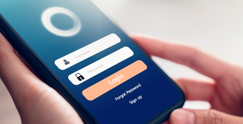 Close up image of a cell phone with log in screen