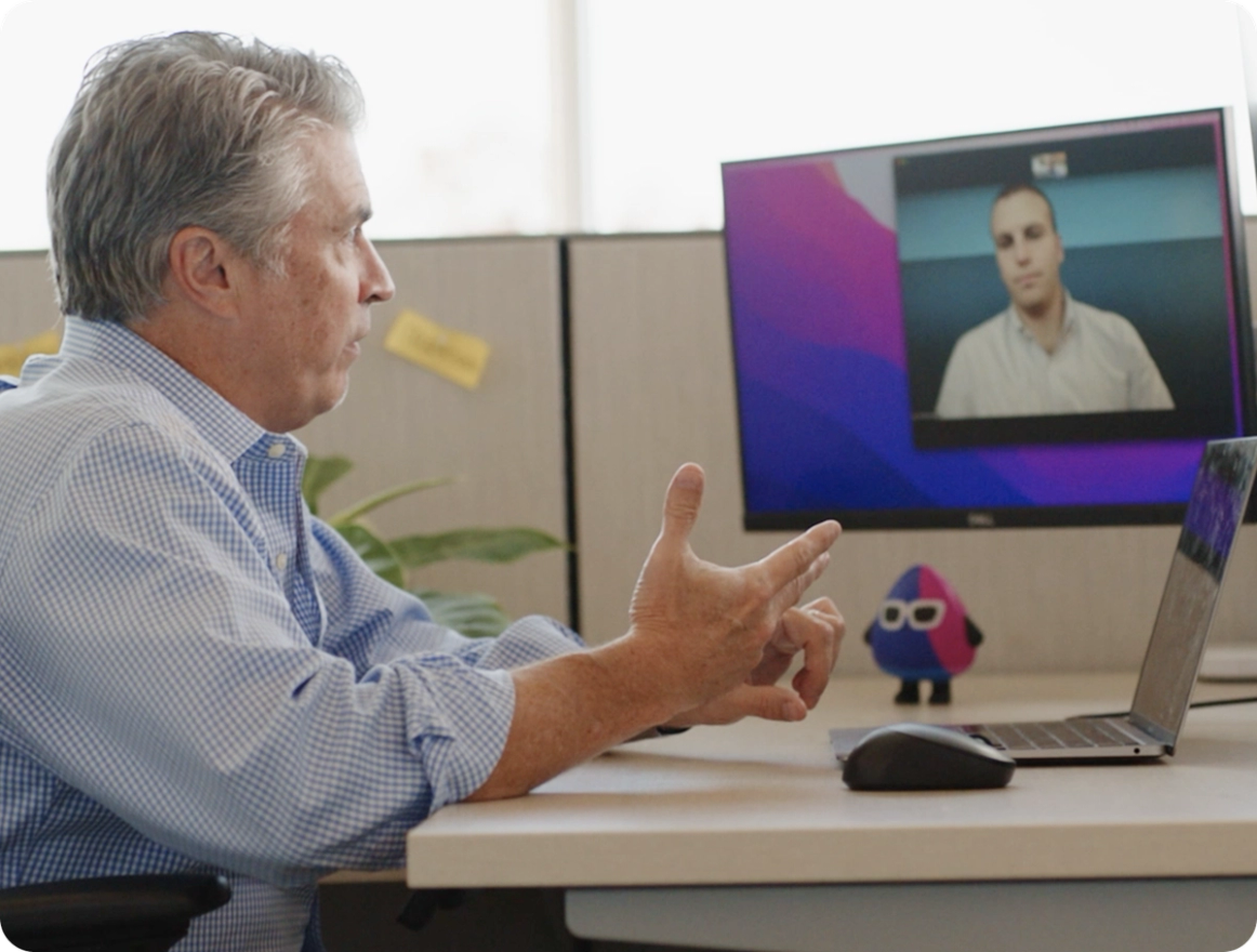 SailPoint employee on a video call while working at a desk