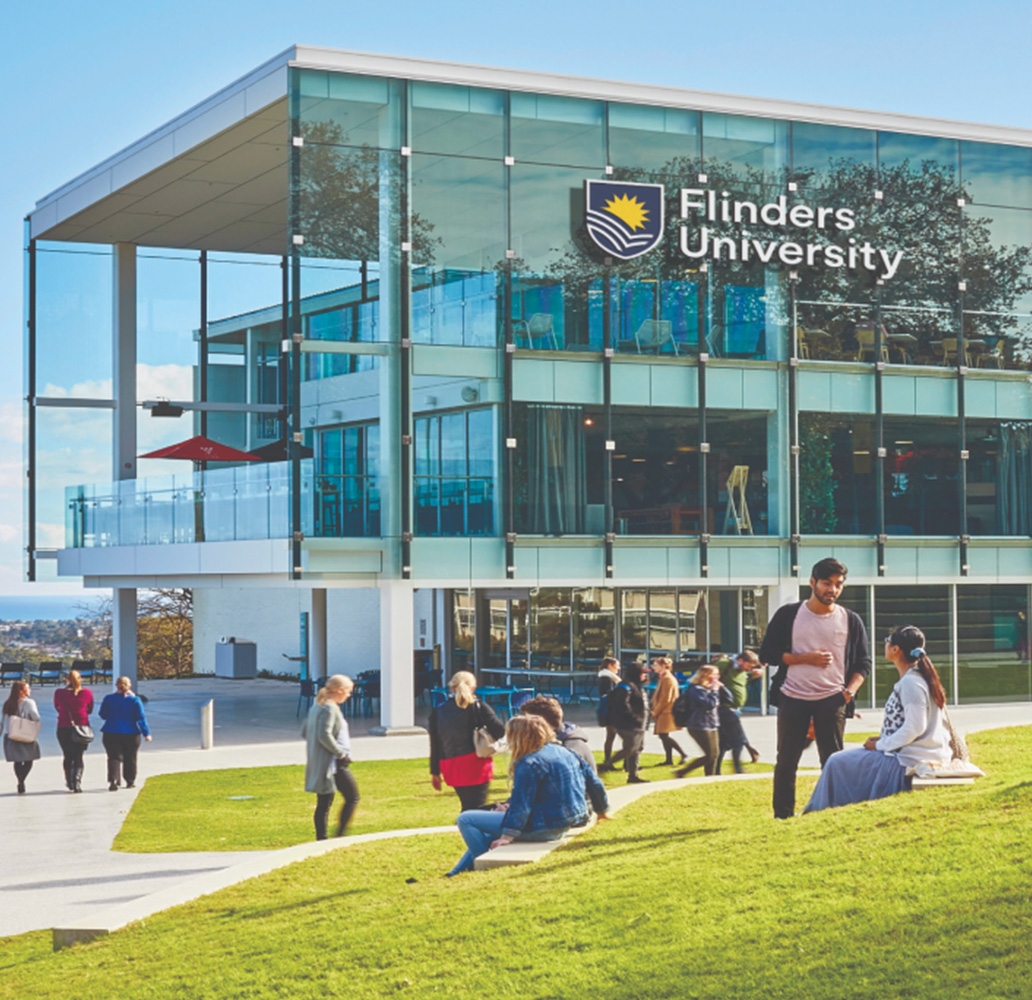 Flinders university campus with students on lawn