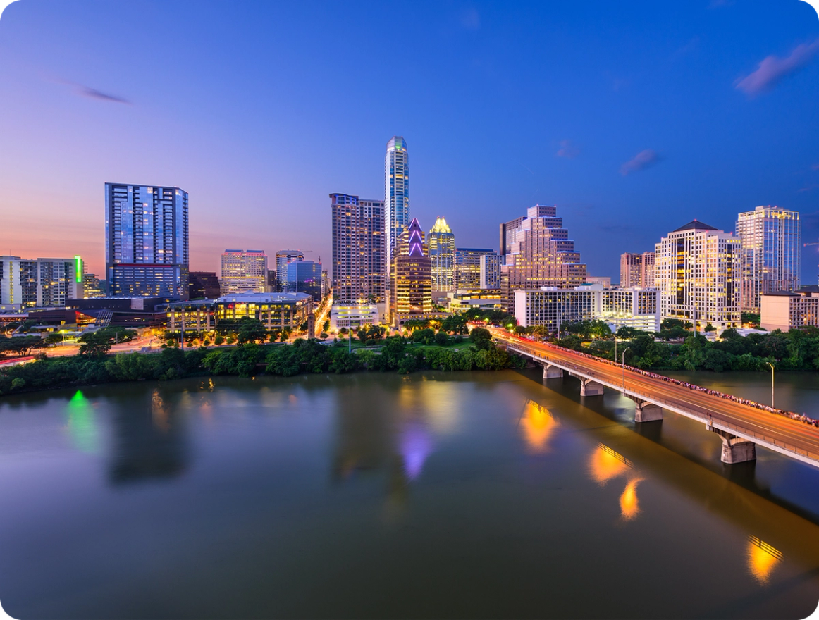 Austin, Texas skyline at dusk with Congress Avenue Bridge