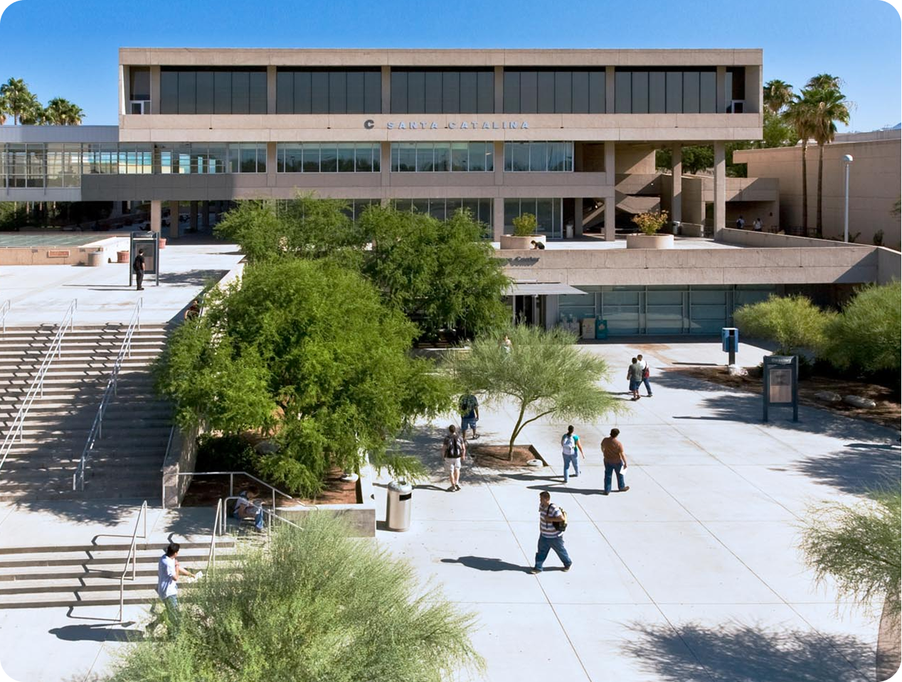 Pima Community college campus in daylight with students walking