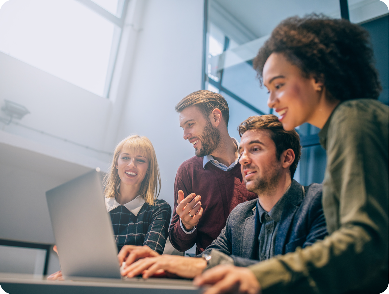 People gathered around a computer