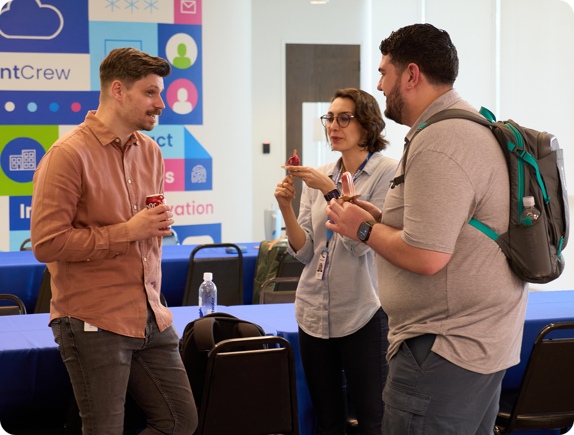 SailPoint crew members talking casually at a company gathering