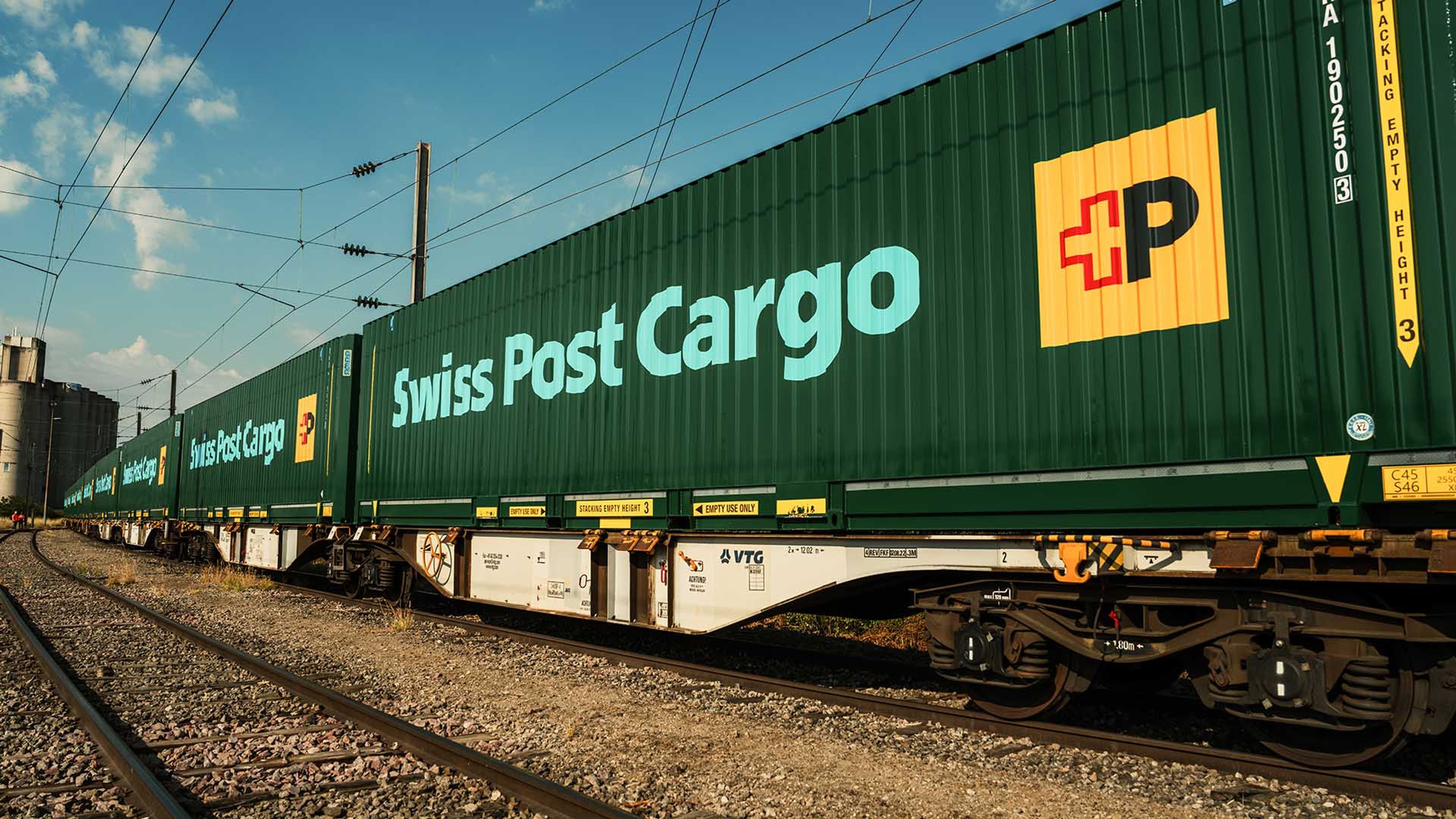 Goods train with Swiss Post Cargo containers in transit between China and Europe.