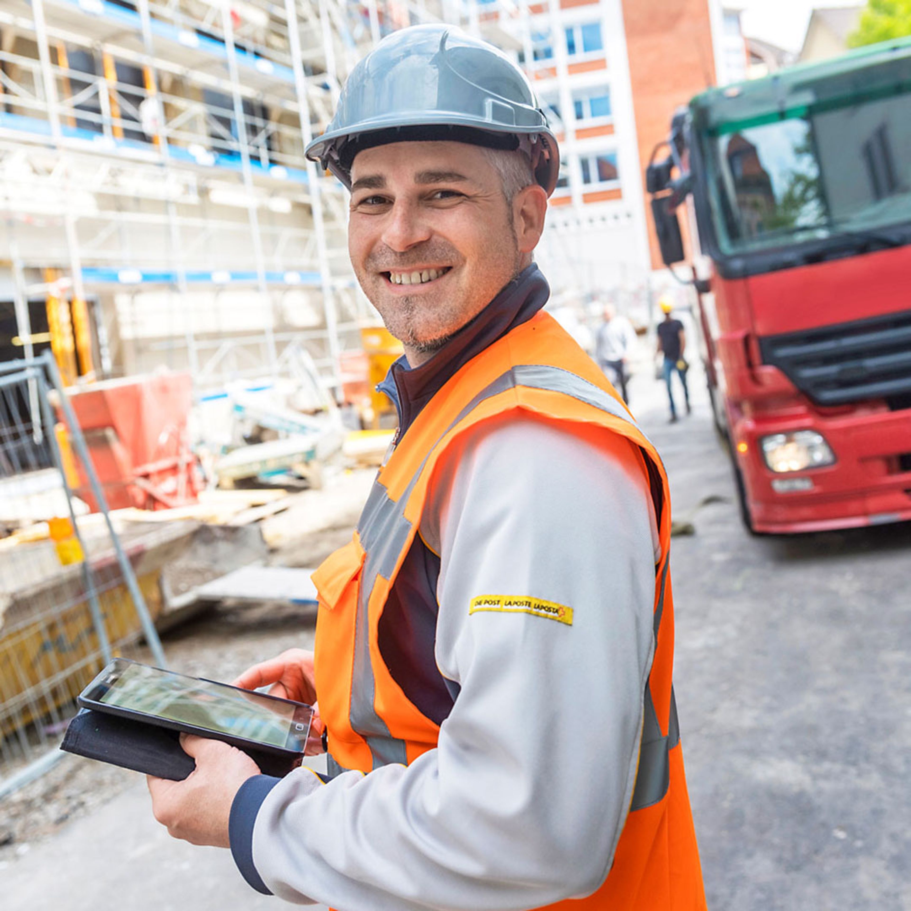 Construction worker forms a square with thumb and index finger of both hands.