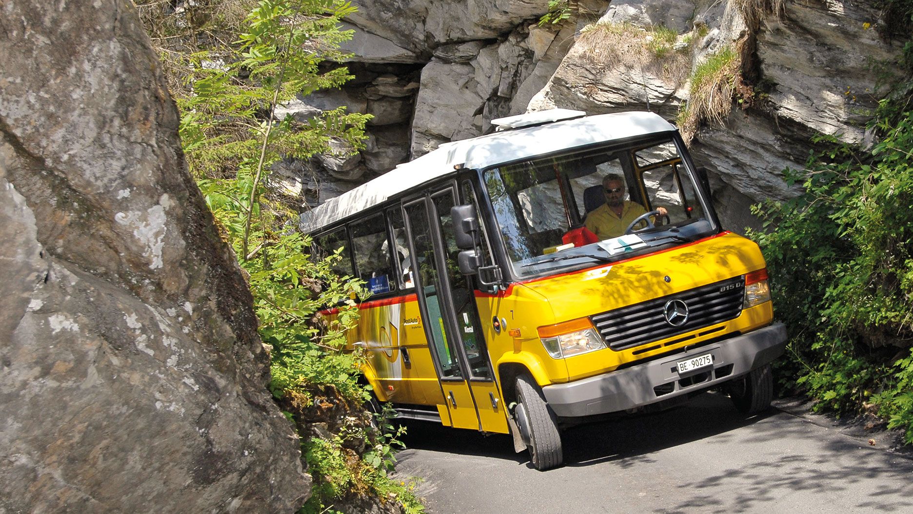 A Postbus on the steep road to Griesalp.