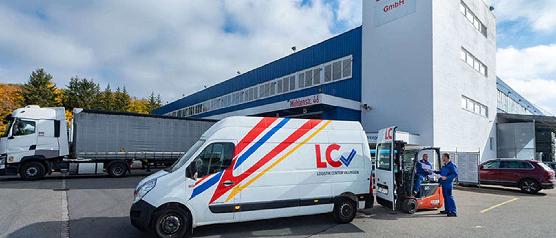 A Swiss Post Cargo truck is parked in front of the LCV headquarters.