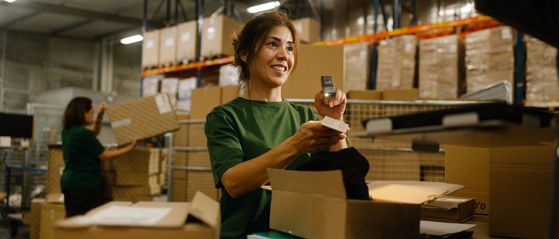 Woman processing parcel returns