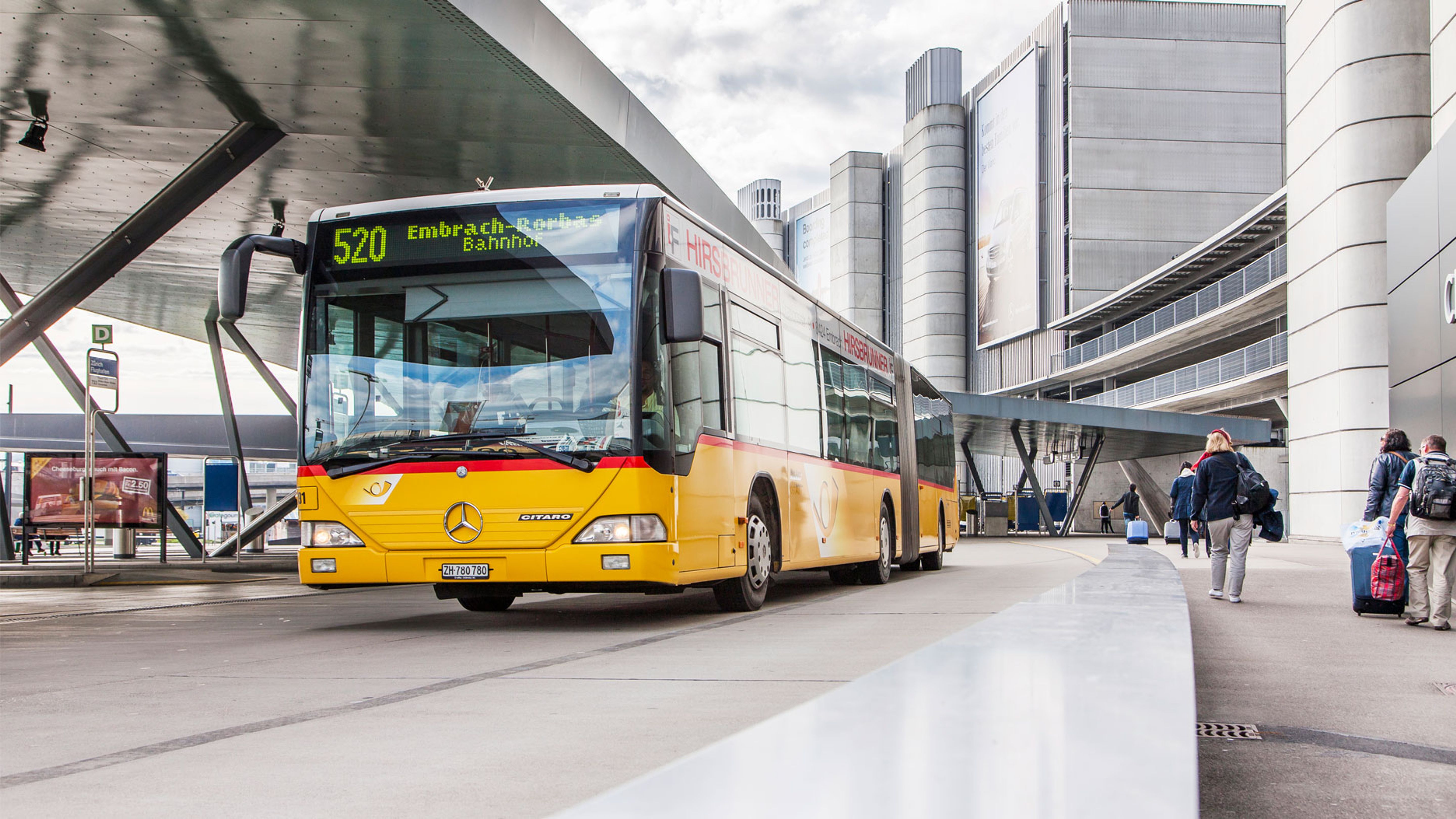 A Postbus with an industrial background