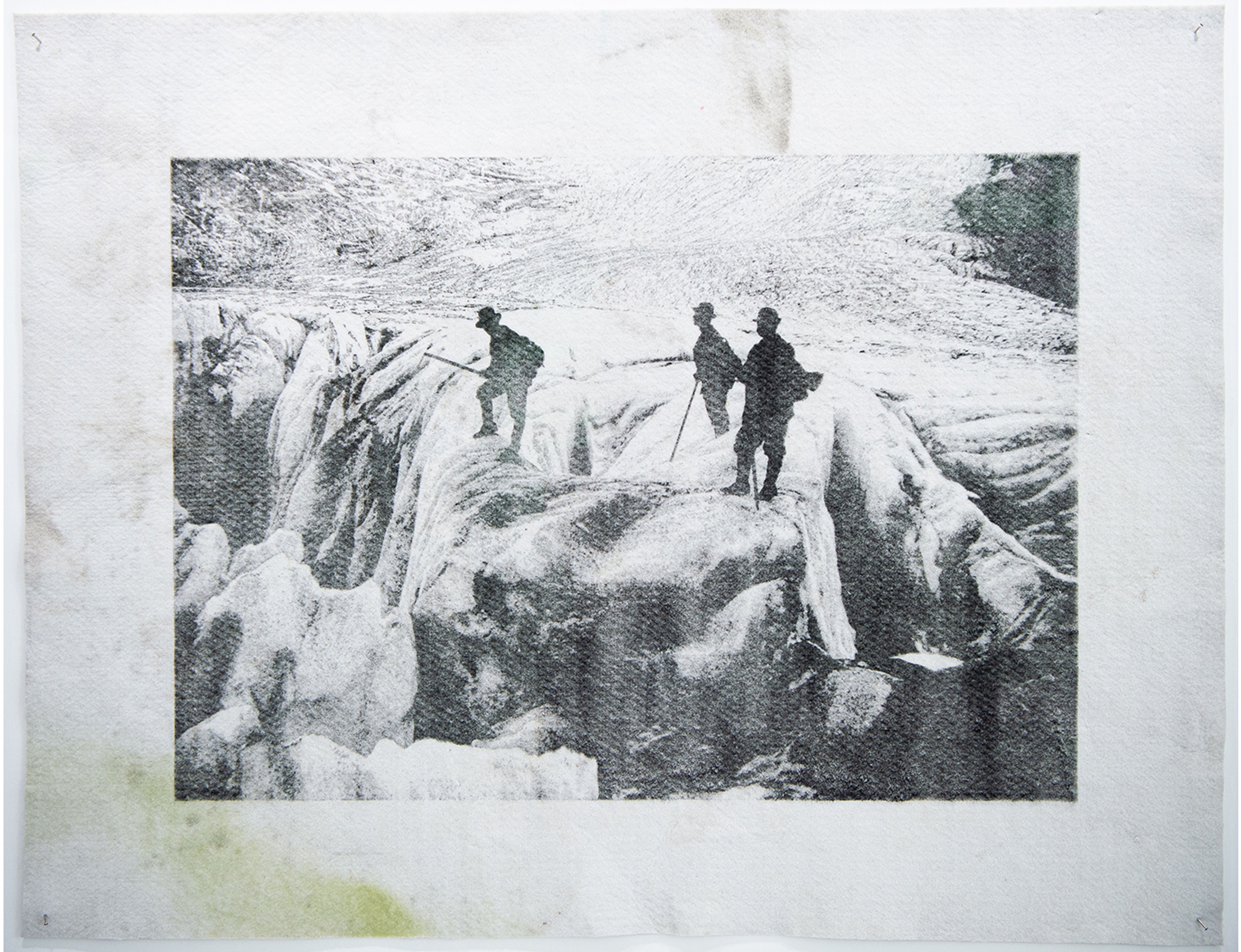 A black and white scene with three people and sticks on a rocky background.