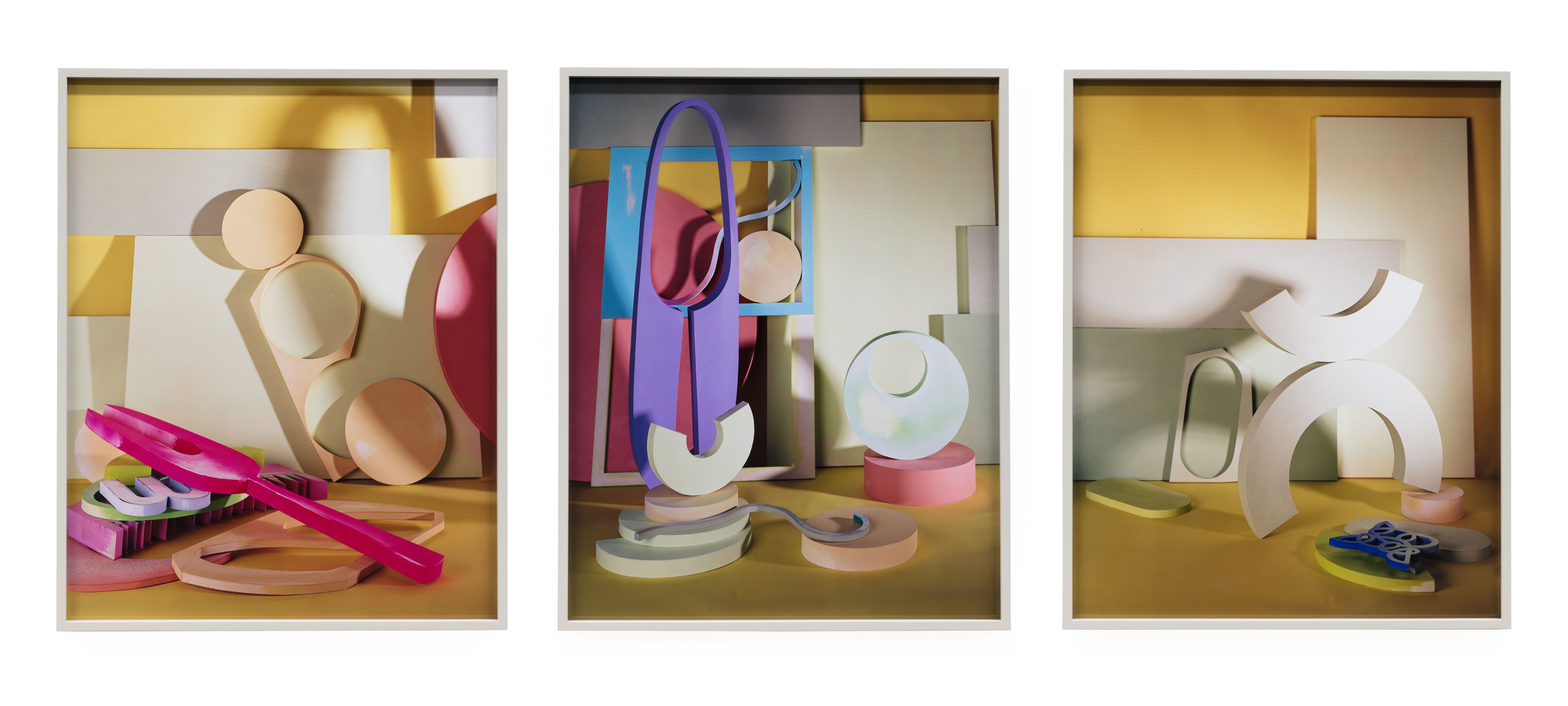Abstract art with geometric shapes in pastel tones on a yellow background.