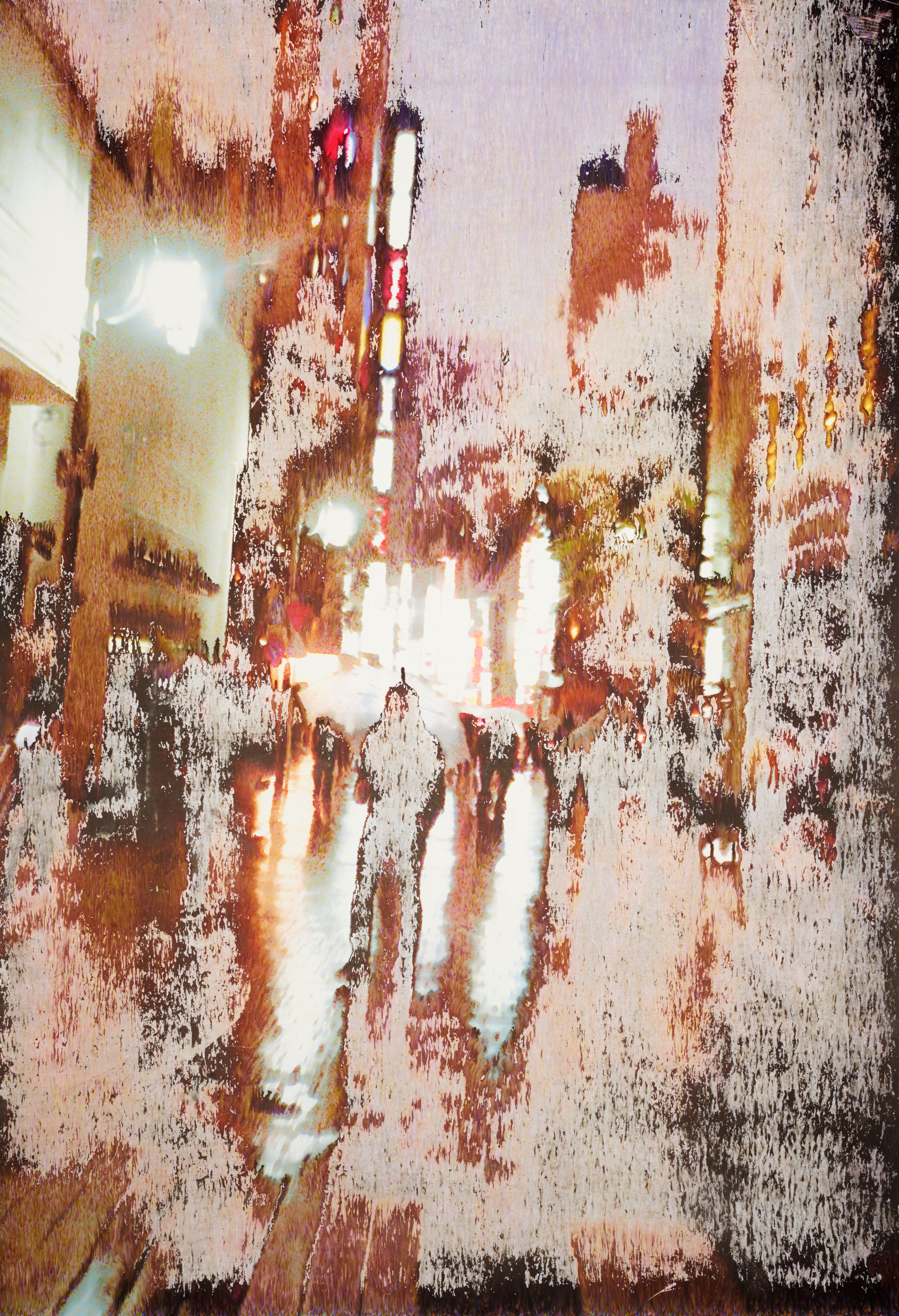 Faded night-time street scene with spotlights and silhouettes of people.