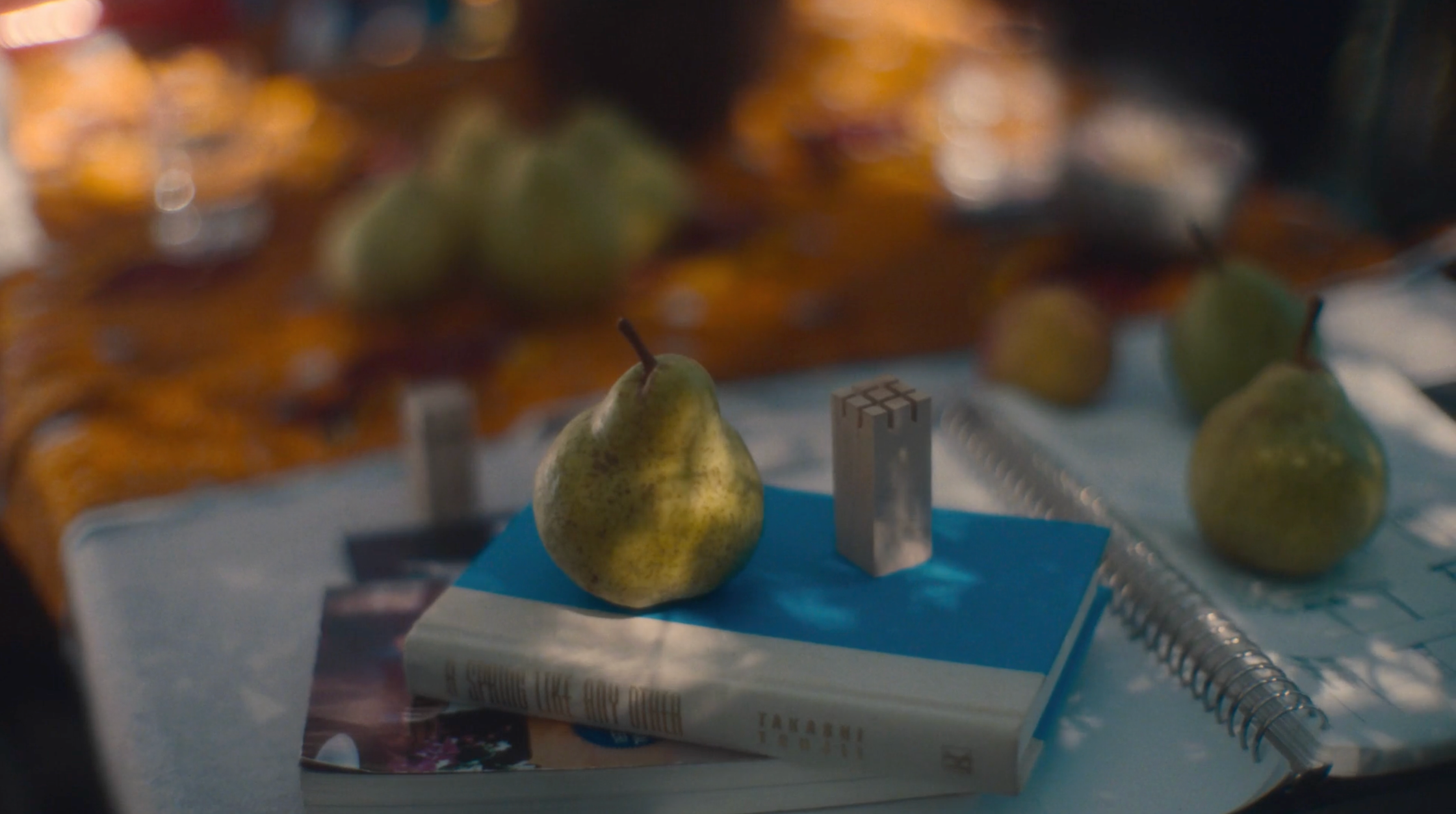 a book with a pear on top