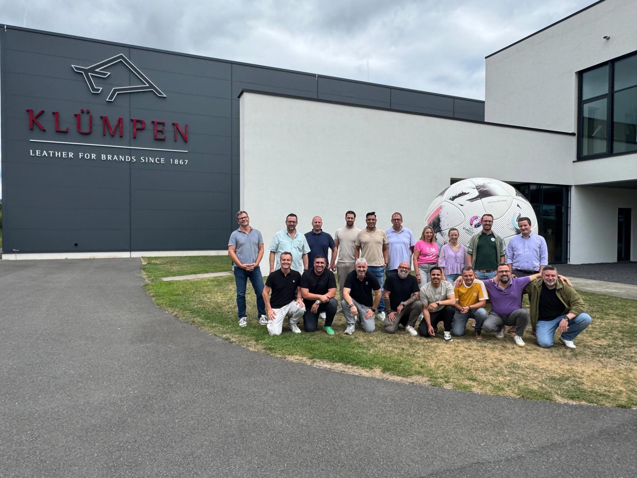 Klümpen team in front of adidas sculpture