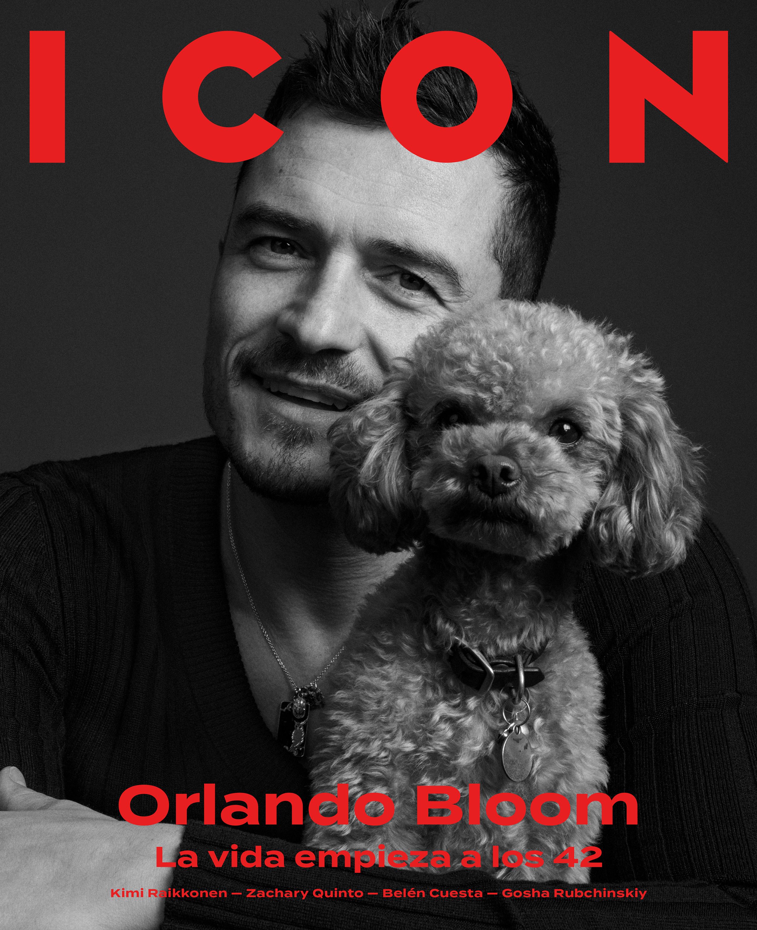 ICON magazine cover: black-and-white portrait of Orlando Bloom smiling in a dark sweater and pendant necklace, cheek to cheek with a small curly-haired dog