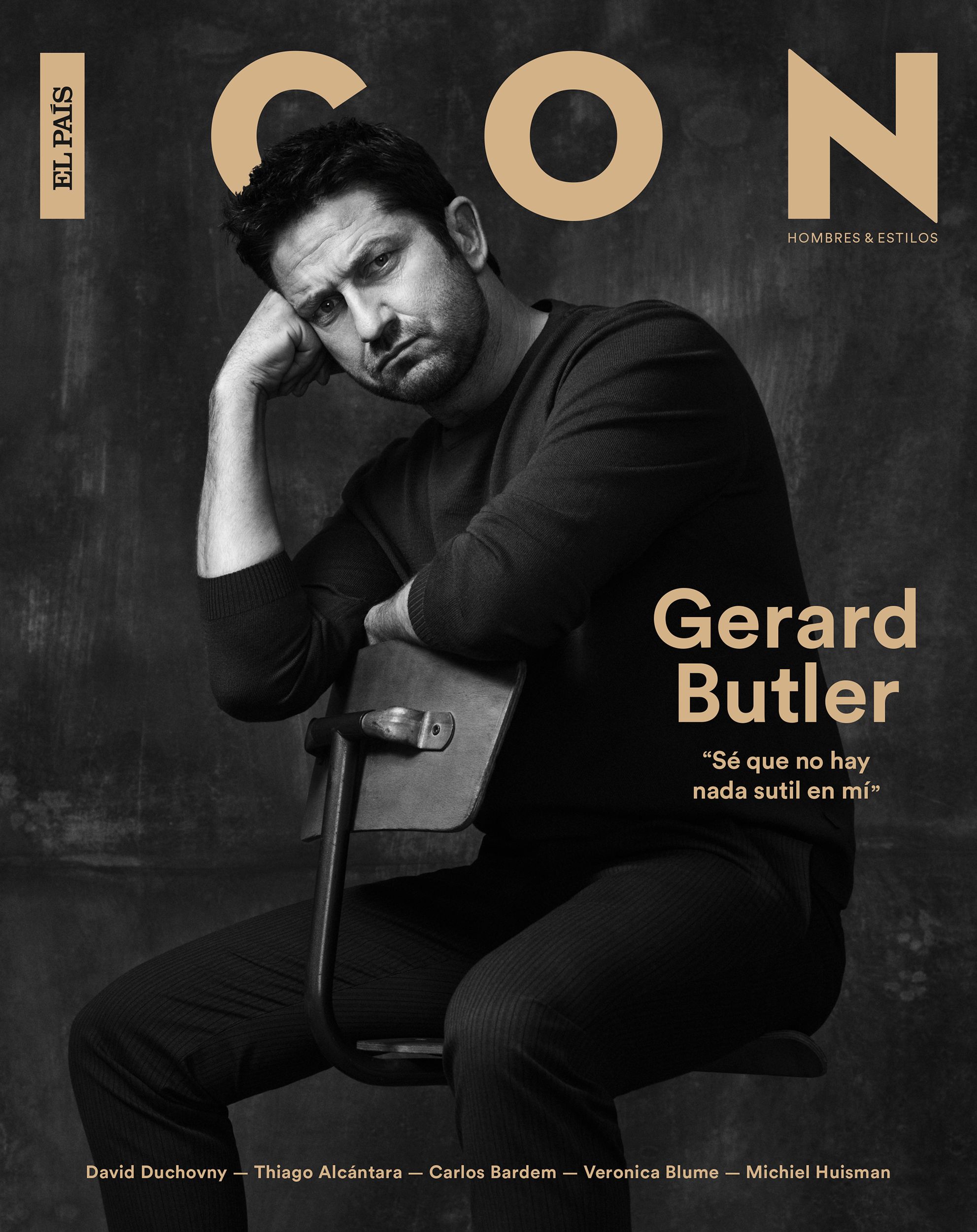 ICON magazine cover: black-and-white portrait of Gerard Butler seated on a chair in dark knitwear, his head resting on his fist