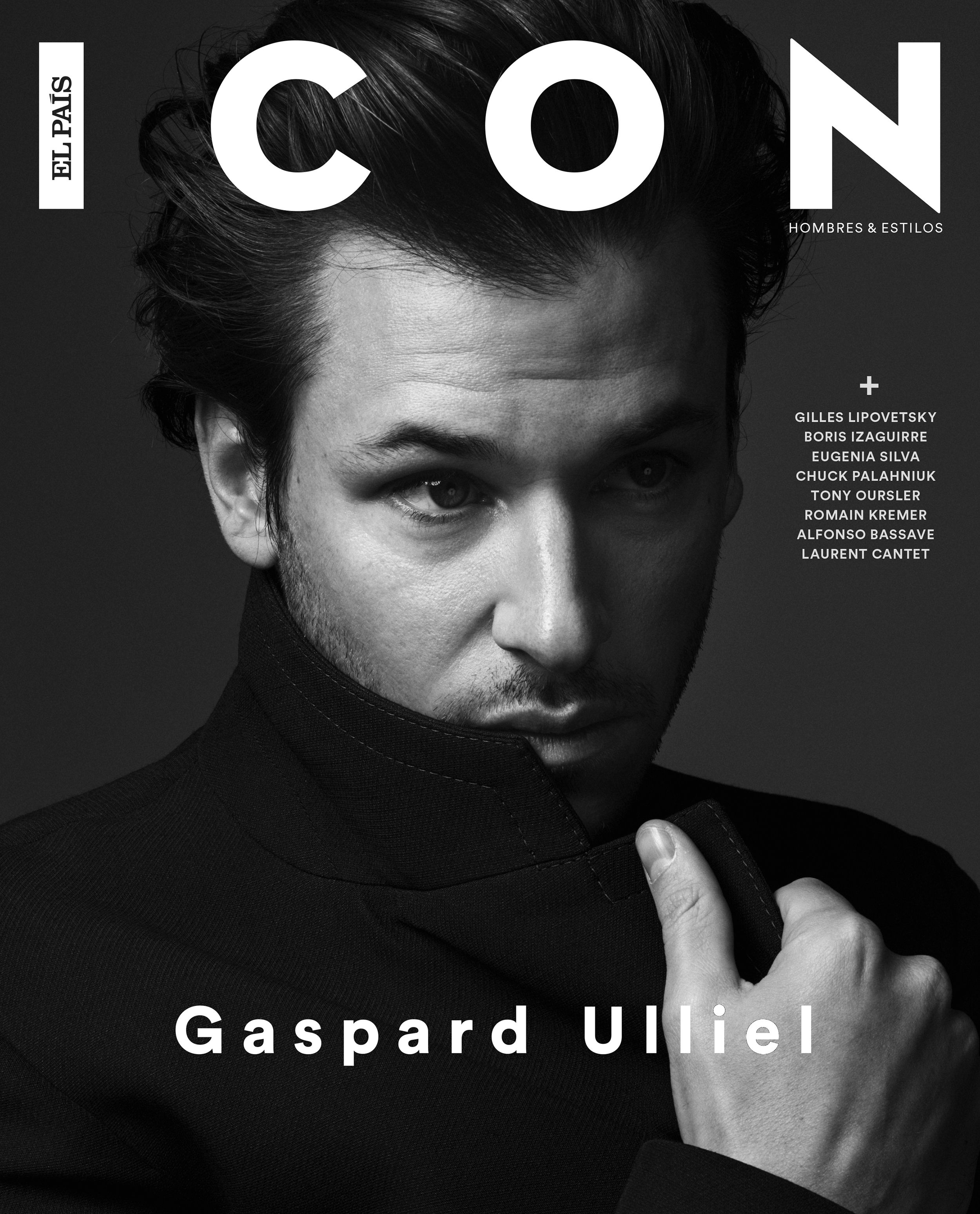 ICON magazine cover: dramatic black-and-white portrait of Gaspard Ulliel in a black high-collar jacket, pulling the collar up over his chin with a shadowed gaze