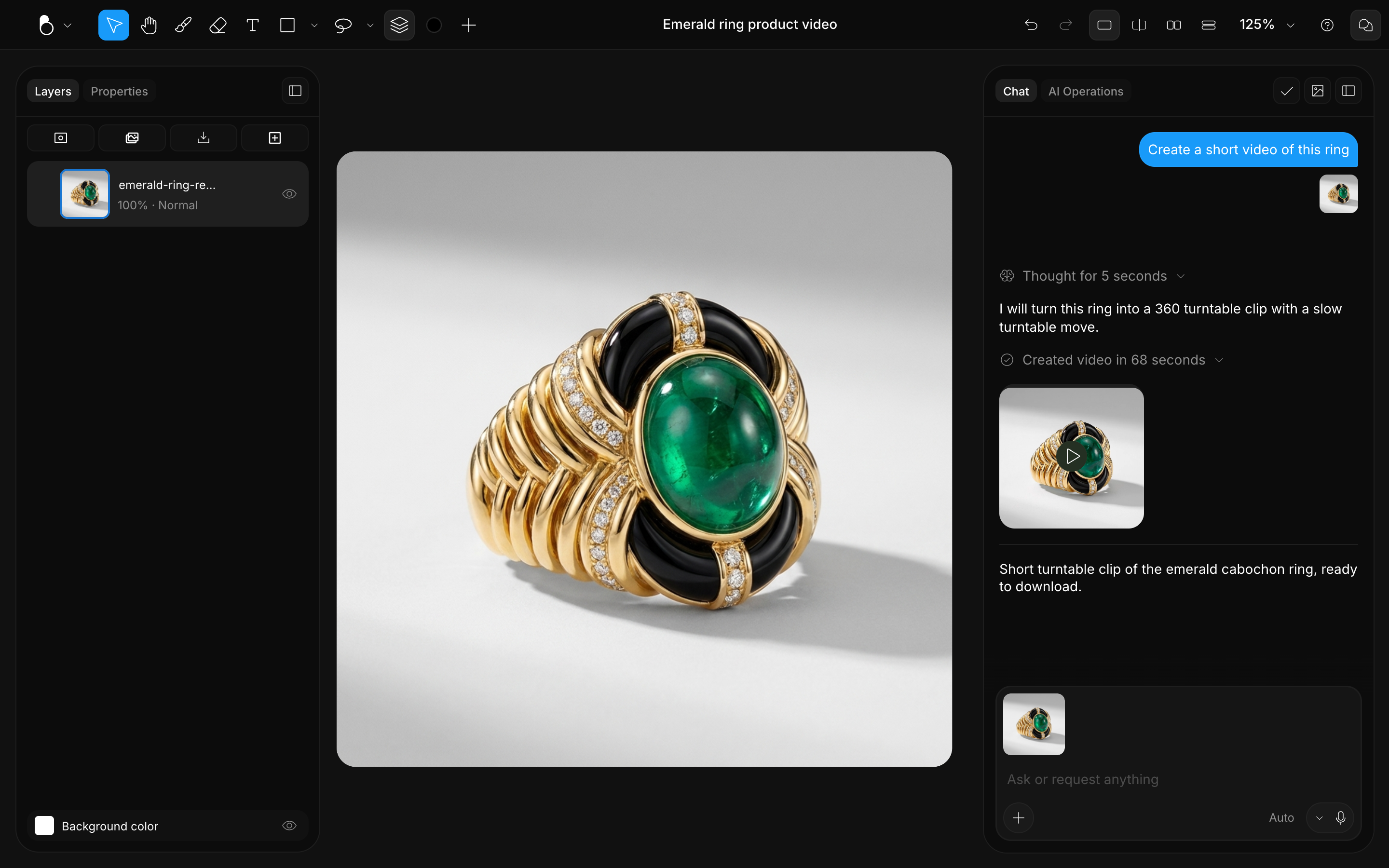 An emerald cabochon ring on the canvas with a turntable video generated in the chat