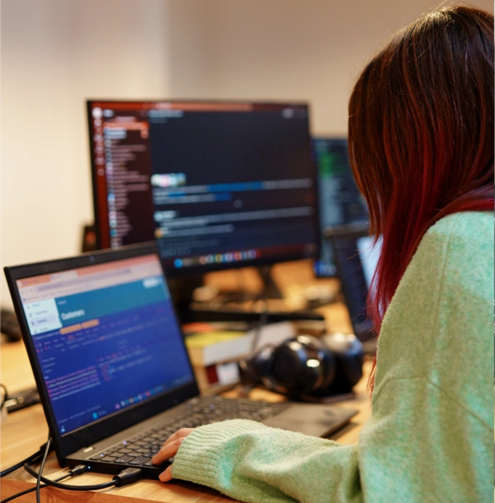 A developer working on her computer