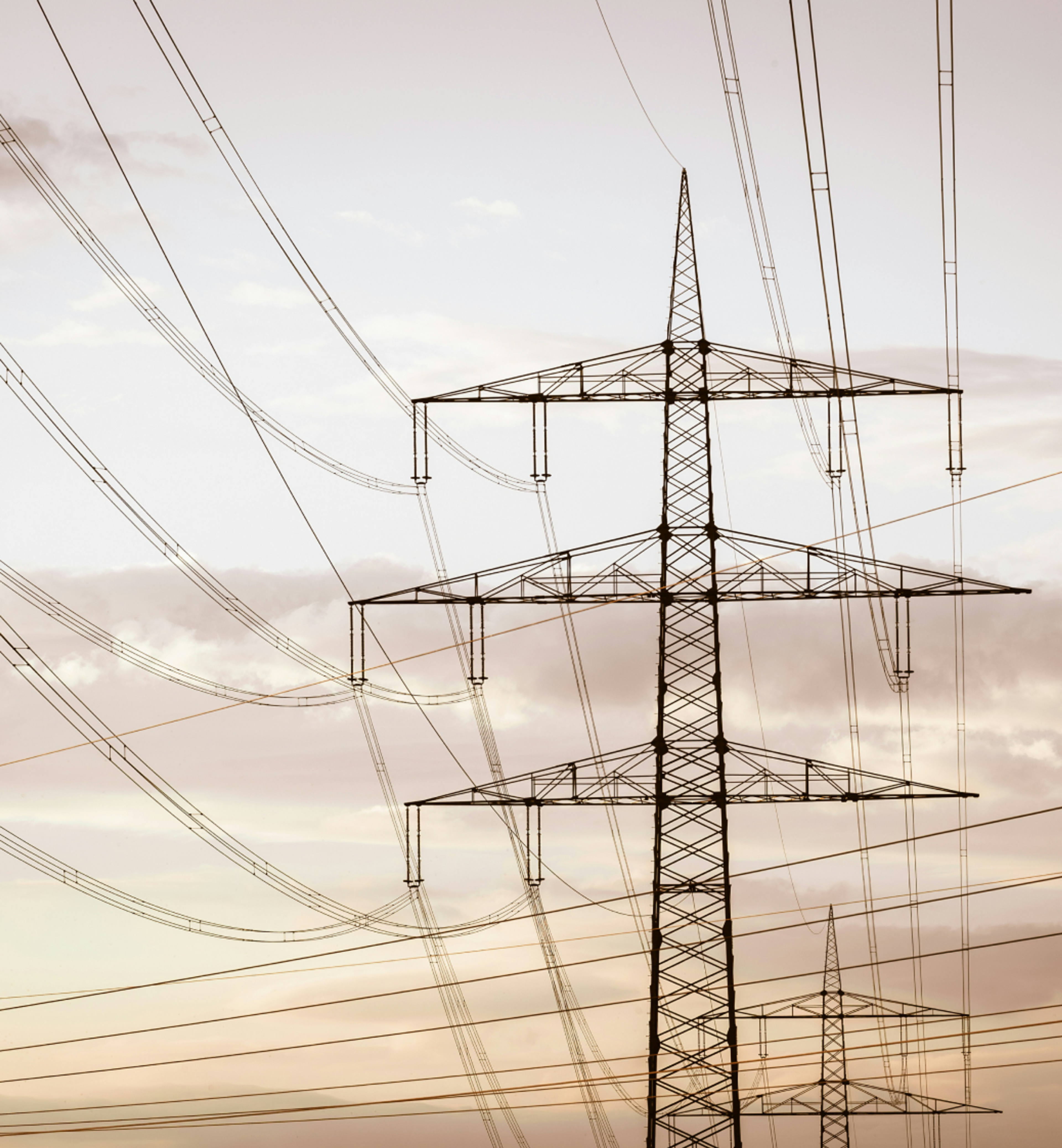 Electrical transmission towers and power lines representing energy infrastructure