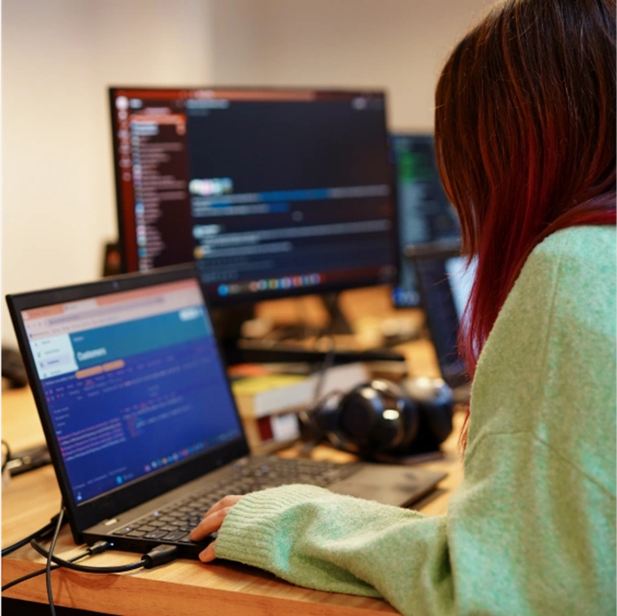 A developer working on her computer